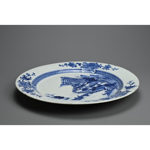 103 - A VERY LARGE CHINESE BLUE AND WHITE PORCELAIN DISH, 18TH CENTURY. Finely decorated with figures cros... 