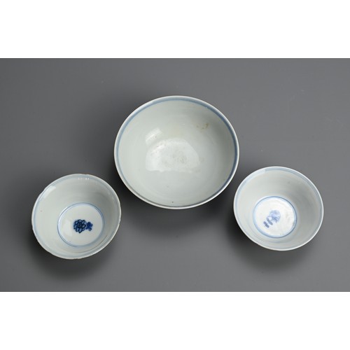 127 - THREE CHINESE BLUE AND WHITE PORCELAIN BOWL AND CUPS, 18/19TH CENTURY. The bowl decorated with ducks... 