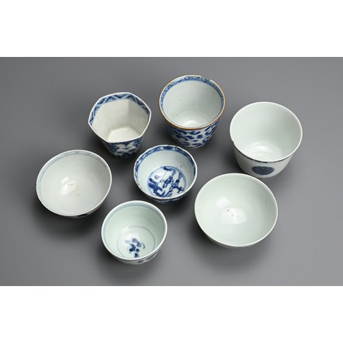 128 - A GROUP OF CHINESE BLUE AND WHITE PORCELAIN CUPS, 18TH CENTURY. Seven cups of various forms decorate... 