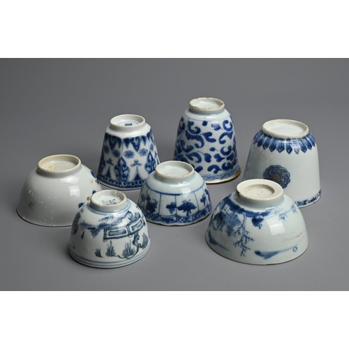 128 - A GROUP OF CHINESE BLUE AND WHITE PORCELAIN CUPS, 18TH CENTURY. Seven cups of various forms decorate... 