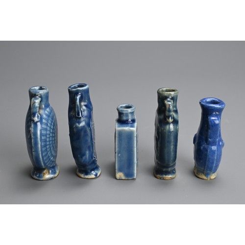 137 - A GROUP OF CHINESE BLUE GLAZED PORCELAIN BOTTLES, QING DYNASTY. Five medicine or snuff bottles of va... 