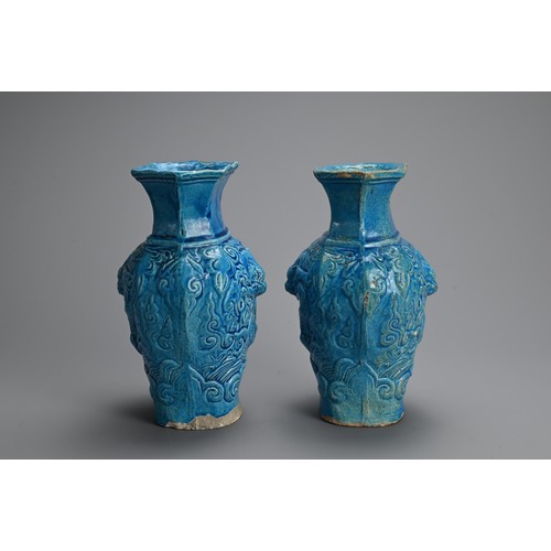 149 - A PAIR OF CHINESE TURQUOISE GLAZED STONEWARE VASES, LATE MING DYNASTY. Each moulded with dragons in ... 