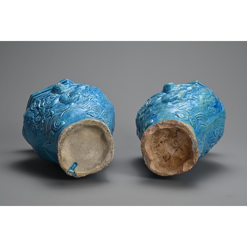 149 - A PAIR OF CHINESE TURQUOISE GLAZED STONEWARE VASES, LATE MING DYNASTY. Each moulded with dragons in ... 