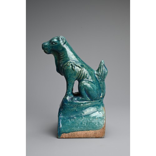 153 - A CHINESE TURQUOISE GLAZED POTTERY ROOF TILE, MING DYNASTY. In the form of a seated dog. 22cm tall. ... 