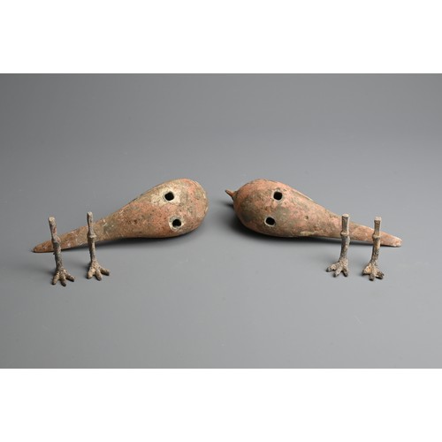 156 - A RARE PAIR OF CHINESE PAINTED POTTERY MODELS OF BIRDS WITH BRONZE FEET, WESTERN HAN DYNASTY. Finely... 