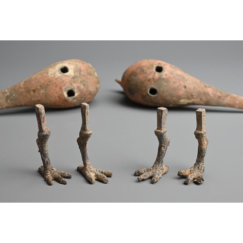 156 - A RARE PAIR OF CHINESE PAINTED POTTERY MODELS OF BIRDS WITH BRONZE FEET, WESTERN HAN DYNASTY. Finely... 