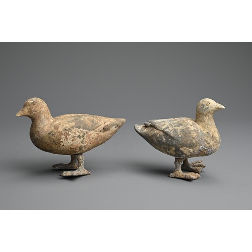 157 - A RARE PAIR OF CHINESE PAINTED POTTERY MODELS OF DUCKS WITH BRONZE FEET, WESTERN HAN DYNASTY. Finely... 