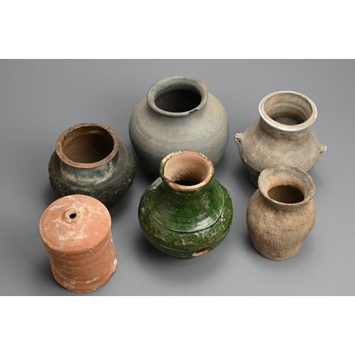 164 - A GROUP OF EARLY CHINESE POTTERY JARS, NEOLITHIC TO PROBABLY YUAN DYNASTY. Six vessels of various fo... 