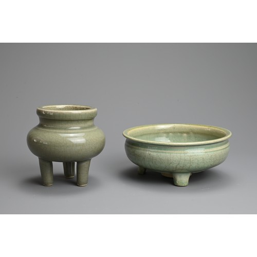 166 - TWO CHINESE LONGQUAN CELADON GLAZED PORCELAIN TRIPOD CENSERS, MING / QING DYNASTY. The first with a ... 