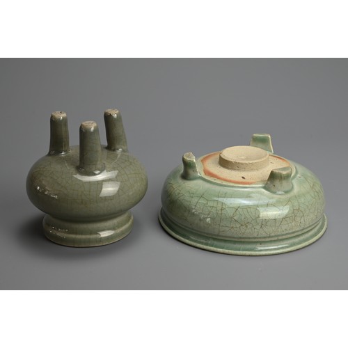 166 - TWO CHINESE LONGQUAN CELADON GLAZED PORCELAIN TRIPOD CENSERS, MING / QING DYNASTY. The first with a ... 