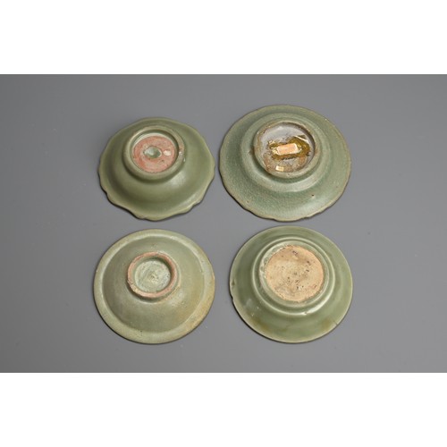 168 - A GROUP OF CHINESE LONGQUAN CELADON GLAZED PORCELAIN DISHES, YUAN /MING DYNASTY. Four dishes of vari... 