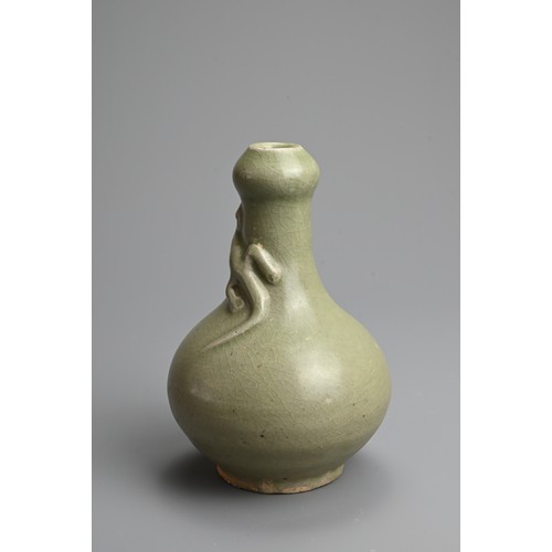 173 - A CHINESE LONGQUAN CELADON GLAZED STONEWARE VASE, MING DYNASTY. Garlic mouth bottle vase with moulde... 