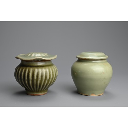 176 - TWO CHINESE LONGQUAN CELADON GLAZED PORCELAIN JARS AND COVERS, MING DYNASTY. Each of compressed balu... 