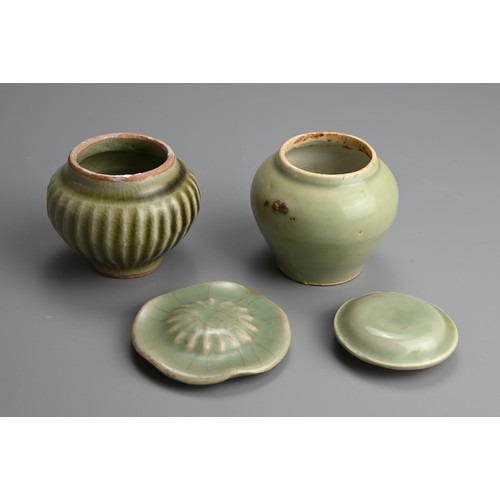 176 - TWO CHINESE LONGQUAN CELADON GLAZED PORCELAIN JARS AND COVERS, MING DYNASTY. Each of compressed balu... 