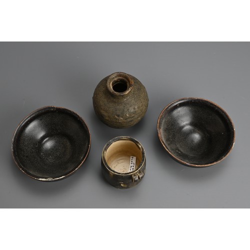 181 - A GROUP OF CHINESE BROWN GLAZED POTTERY ITEMS, 12/13TH CENTURY. To include a rare bird feeder with d... 