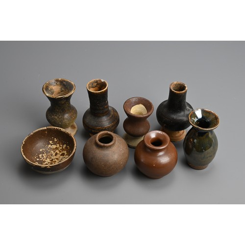 182 - A GROUP OF CHINESE BROWN GLAZED POTTERY JARS AND BOWL, 12TH CENTURY AND LATER. To include five vases... 