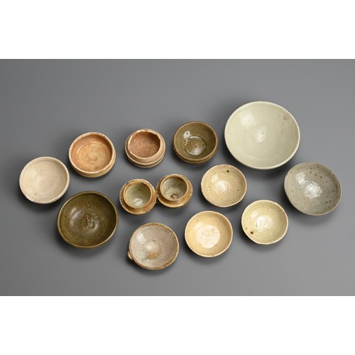 188 - A MIXED GROUP OF CHINESE PORCELAIN STONEWARE DISHES AND POTS, 12 - 16TH CENTURY. To include a conjoi... 