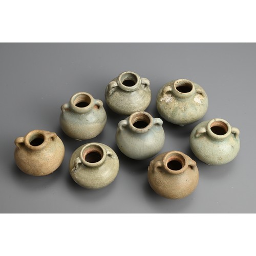 190 - A GROUP OF THAI SAWANKHALOK CELADON GLAZED STONEWARE JARLETS, 14/15TH CENTURY. Each with globular bo... 