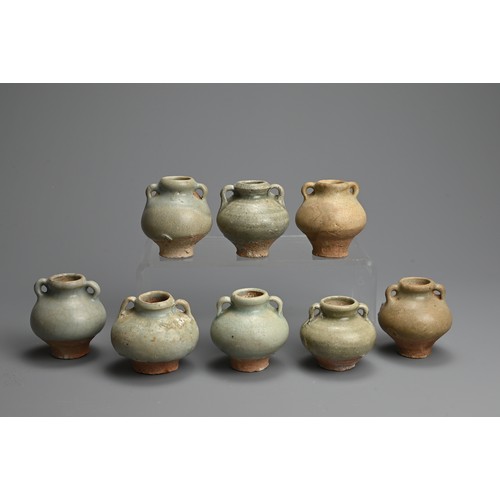 190 - A GROUP OF THAI SAWANKHALOK CELADON GLAZED STONEWARE JARLETS, 14/15TH CENTURY. Each with globular bo... 