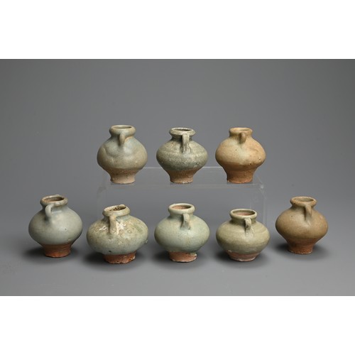 190 - A GROUP OF THAI SAWANKHALOK CELADON GLAZED STONEWARE JARLETS, 14/15TH CENTURY. Each with globular bo... 