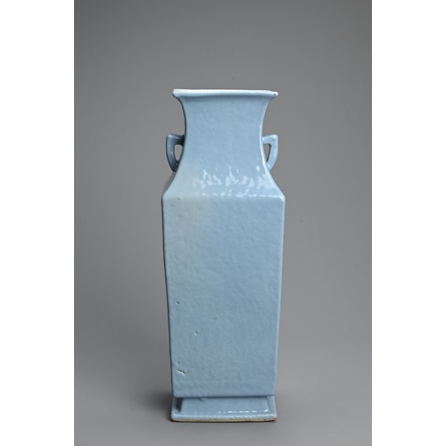 238 - A CHINESE CLAIRE DE LUNE GLAZED PORCELAIN VASE, 19TH CENTURY. Of square baluster form on a splayed f... 