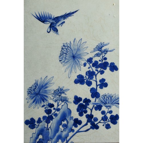 223 - A CHINESE FRAMED BLUE AND WHITE PORCELAIN TILE, 19/20TH CENTURY. Of rectangular form decorated with ... 