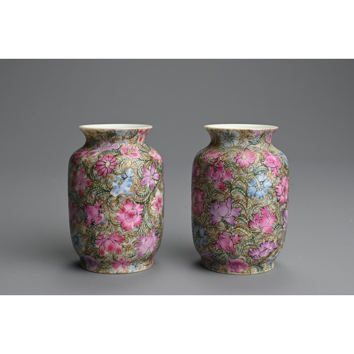 224 - A PAIR OF CHINESE FAMILLE ROSE MILLEFLEUR MINIATURE PORCELAIN VASES, 19/20TH CENTURY. Finely potted ... 