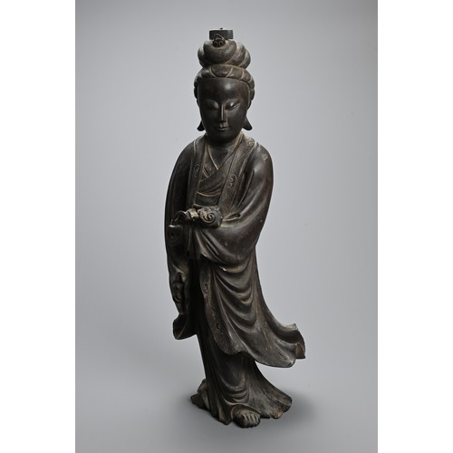 232 - A LARGE CHINESE CARVED WOODEN FIGURE OF GUANYIN, LATE 19TH CENTURY. Dressed in long flowing robes ho... 