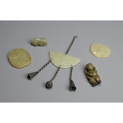 235 - A GROUP OF CHINESE CELADON JADE ITEMS. To include a carved and pierced butterfly pendant with Buddhi... 