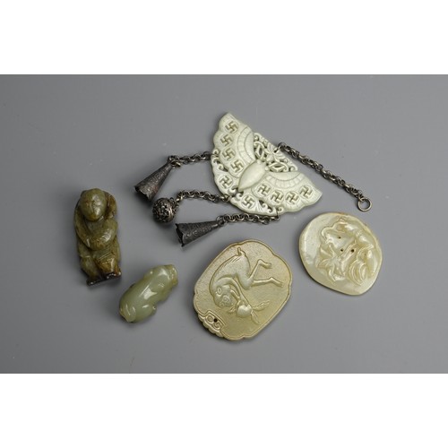 235 - A GROUP OF CHINESE CELADON JADE ITEMS. To include a carved and pierced butterfly pendant with Buddhi... 