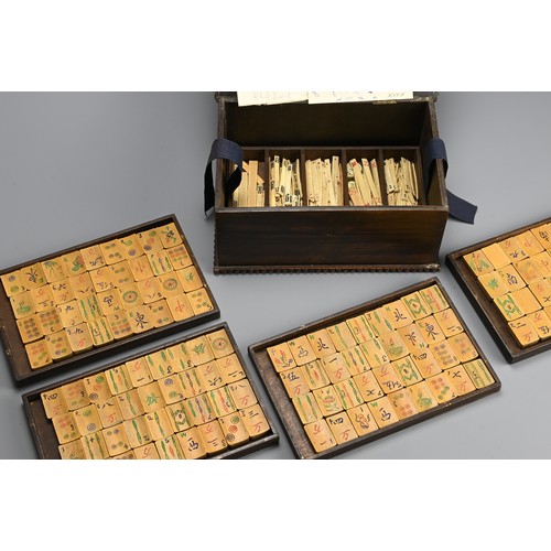 237 - A CHINESE BOXED MAHJONG SET, EARLY 20TH CENTURY. A complete set of hand engraved bamboo tiles and bo... 