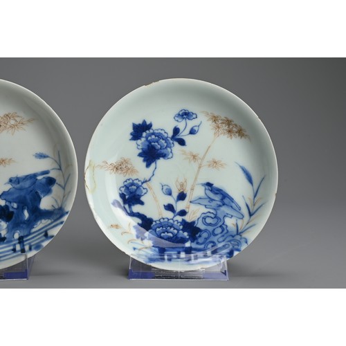 239 - THREE CHINESE BLUE AND WHITE GILT DECORATED SAUCERS, 18TH CENTURY. Each featuring a bird on rockwork... 