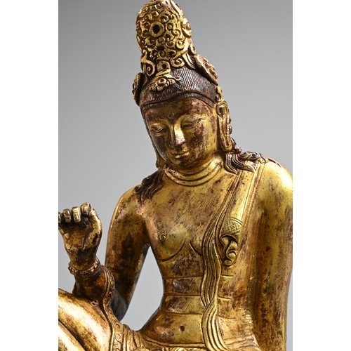 247 - A FINE GILT BRONZE FIGURE OF BODHISATTVA, PROBABLY NEPALESE, 18TH CENTURY. Heavily cast, seated in R... 