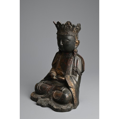 257 - A CHINESE RED LACQUER AND GILT BRONZE FIGURE OF BUDDHA, MING DYNASTY STYLE. Seated dressed in robes ... 