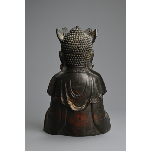 257 - A CHINESE RED LACQUER AND GILT BRONZE FIGURE OF BUDDHA, MING DYNASTY STYLE. Seated dressed in robes ... 