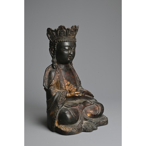 257 - A CHINESE RED LACQUER AND GILT BRONZE FIGURE OF BUDDHA, MING DYNASTY STYLE. Seated dressed in robes ... 