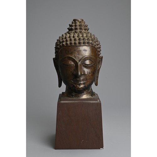 258 - A THAI BRONZE HEAD OF BUDDHA, 18TH CENTURY. Heavily cast with downcast eyes and serene expression. M... 