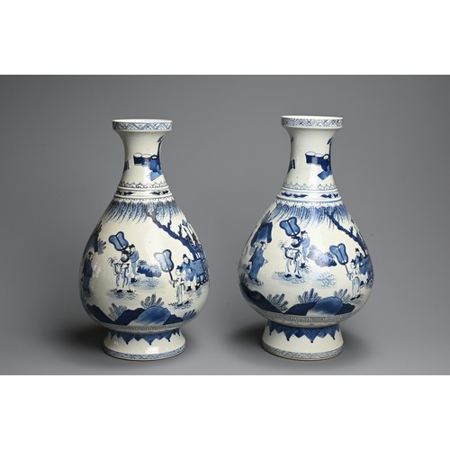 311 - A LARGE NEAR PAIR OF CHINESE BLUE AND WHITE PORCELAIN VASES, 20TH CENTURY. Of pear shape on a tall s... 