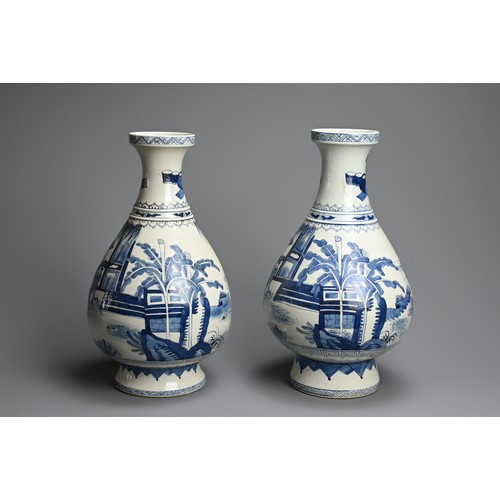 311 - A LARGE NEAR PAIR OF CHINESE BLUE AND WHITE PORCELAIN VASES, 20TH CENTURY. Of pear shape on a tall s... 