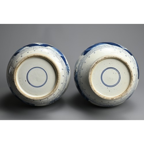 311 - A LARGE NEAR PAIR OF CHINESE BLUE AND WHITE PORCELAIN VASES, 20TH CENTURY. Of pear shape on a tall s... 