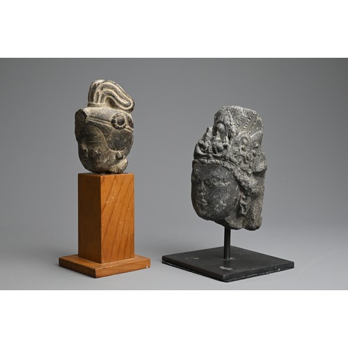 261 - TWO CHINESE CARVED GREY STONE HEADS OF GUANYIN. Each with headdress mounted on later display stands.... 