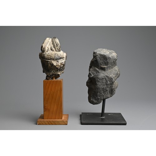 261 - TWO CHINESE CARVED GREY STONE HEADS OF GUANYIN. Each with headdress mounted on later display stands.... 