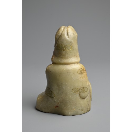 262 - A CHINESE CARVED SOAPSTONE FIGURE OF GUANYIN, 19/20TH CENTURY. The figure seated dressed in robes in... 