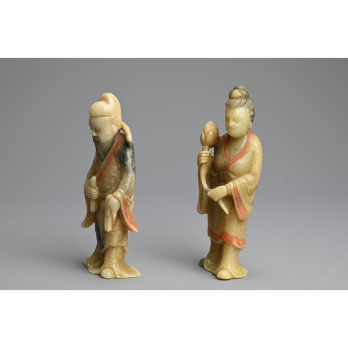 263 - A PAIR OF PAINTED SOAPSTONE FIGURES OF IMMORTALS, 19/20TH CENTURY. Each stood dress in robes with in... 