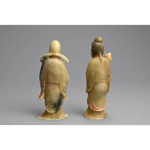 263 - A PAIR OF PAINTED SOAPSTONE FIGURES OF IMMORTALS, 19/20TH CENTURY. Each stood dress in robes with in... 