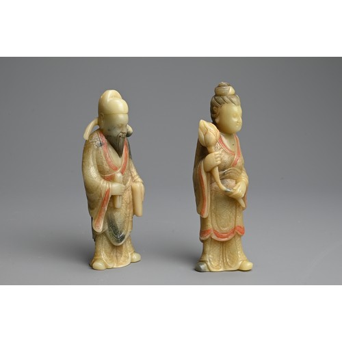 263 - A PAIR OF PAINTED SOAPSTONE FIGURES OF IMMORTALS, 19/20TH CENTURY. Each stood dress in robes with in... 