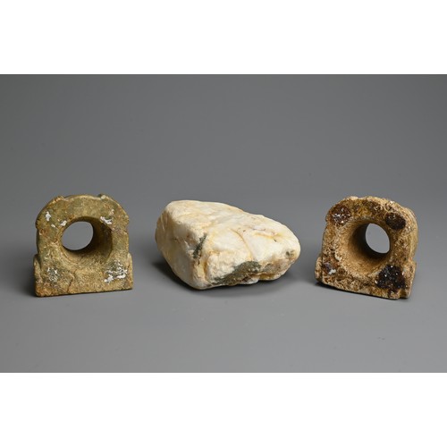 269 - TWO EARLY ASIAN HARDSTONE FITTINGS AND BOULDER. The fittings of Taotie mask form with cylindrical op... 