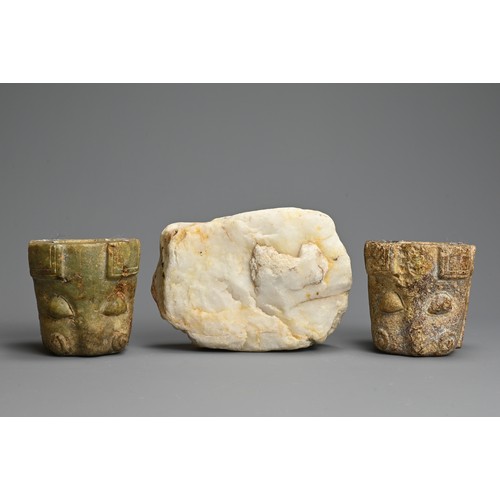 269 - TWO EARLY ASIAN HARDSTONE FITTINGS AND BOULDER. The fittings of Taotie mask form with cylindrical op... 