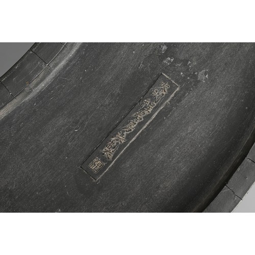 271 - A CHINESE INK CAKE IN THE FORM OF A BRUSH WASHER, SIGNED CHENG JUNFANG. Of curved rectangular form w... 