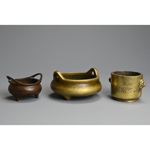 275 - THREE CHINESE BRONZE CENSERS, 19/20TH CENTURY. The largest of circular form with raised handles and ... 